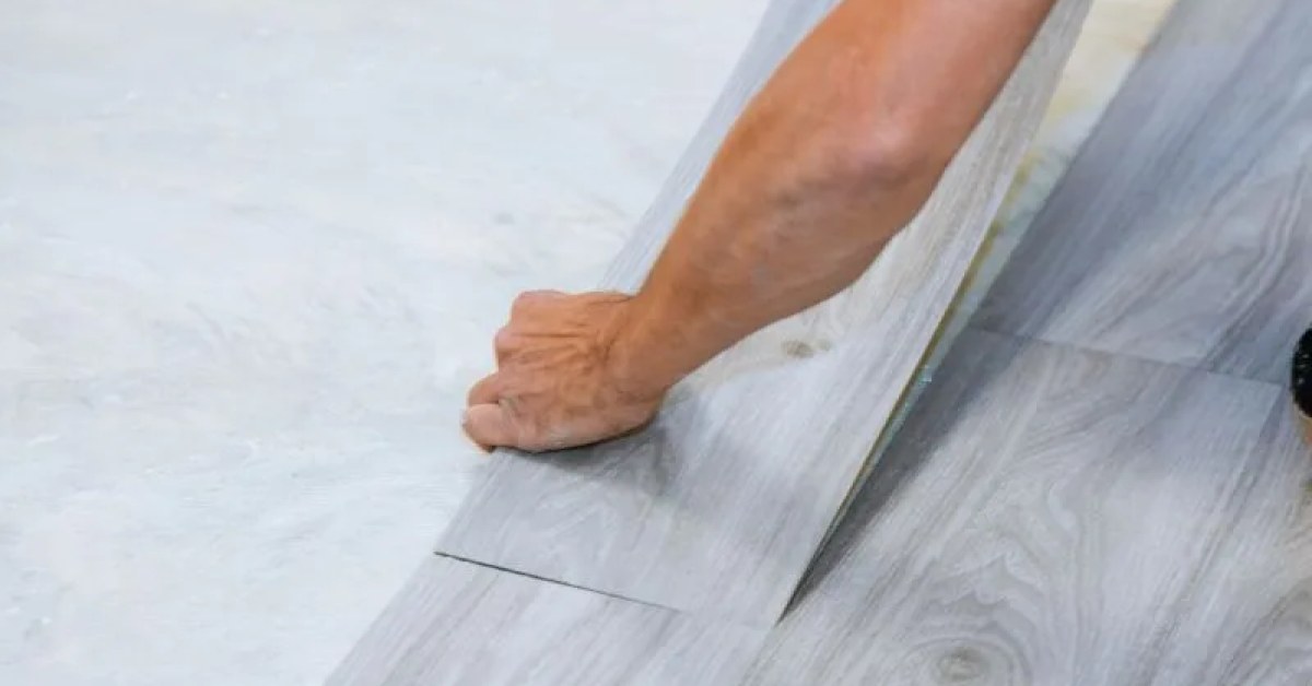 Damaged sheet flooring area prepared for a repair estimate